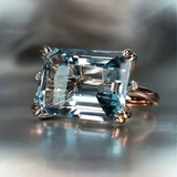 Emerald-Cut Sky Blue Topaz Solitaire Ring in Rose Gold