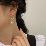 Golden Knot Statement Earrings with Champagne Pearl Drop – Modern Elegance