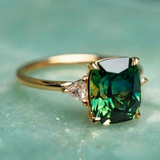 Gold Ring with Emerald-Cut Green Gemstone and Side Diamonds