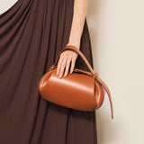 Sculpted Leather Shoulder Bag with Artistic Form